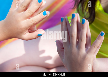 Friends touching hands Stock Photo