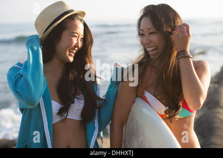 Two female friends with surfboard, San Diego, California, USA Stock Photo