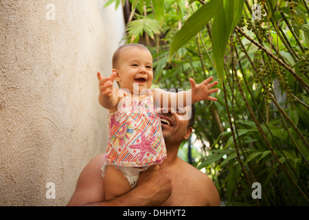 Grandfather holding baby granddaughter Stock Photo