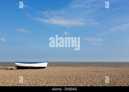 Suffolk, UK - Aldeburgh beach, East coast of England, Uk with old wooden boat on the shingle Stock Photo
