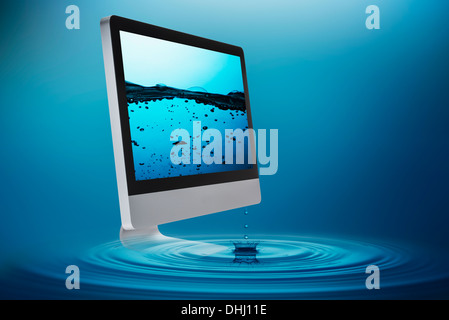 Still life with personal computer and floating dollar bills Stock Photo ...