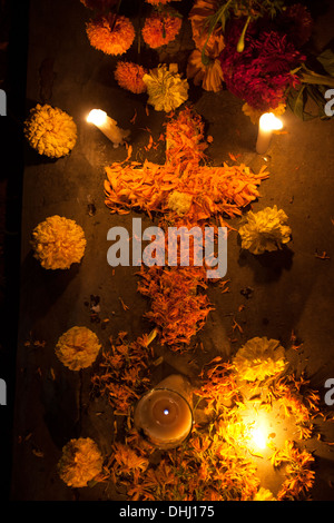 A cross made of marigold flowers decorate a tomb during the Day of the Dead in Santa Cruz Xoxocotlan, Oaxaca, Mexico Stock Photo