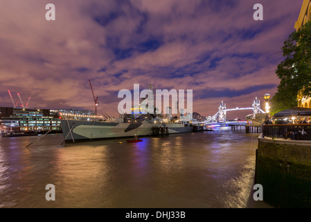 Night shot of the River Thames, HMS Belfast, Tower Bridge in early dusk Stock Photo