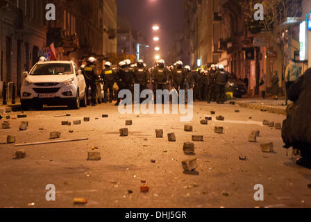 WARSAW, Poland, Monday, 11th November 2013. Police stands on destroyed Skorupki street during Polish Independence Day. Here there were a fight between squatters who live in abandoned house and participants of Independence March organized by All-Polish Youth and National Radical Camp. Credit:  Jakub Siemiaczko/Alamy Live News Stock Photo