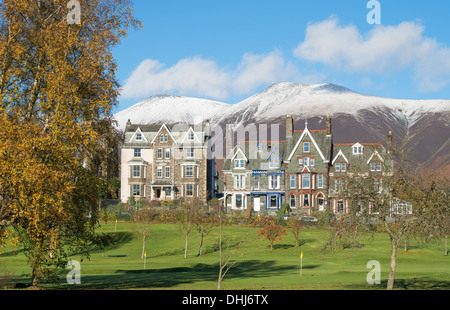 Keswick hotels and B&B in The Headlands from Hope Park with snow covered mountains in the background , Cumbria, England, UK Stock Photo