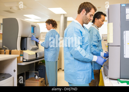 Researchers Working In Laboratory Stock Photo
