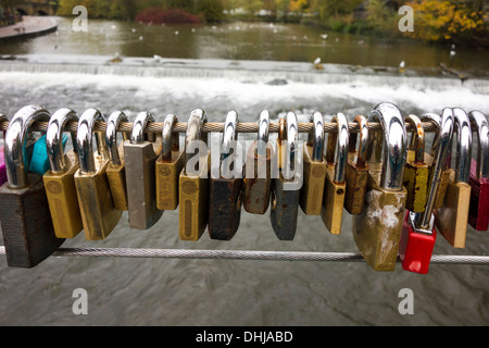 Love padlocks on a bridge over the River Wye at Bakewell, Derbyshire. Stock Photo