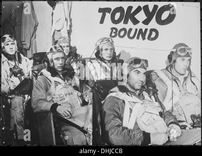 Pilots aboard a U.S. Navy aircraft carrier receive last minute instructions before taking off to attack industrial, and 789 Stock Photo