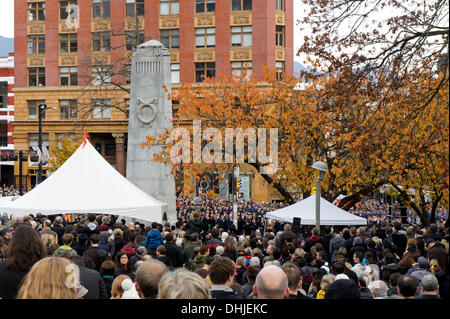 People gather at the Remembrance Day ceremonies at the Victory Square Cenotaph in downtown Vancouver, British Columbia, Canada Stock Photo