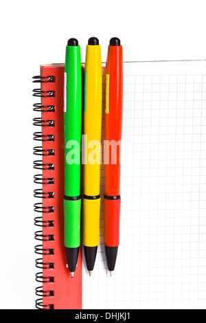 Notebook and 3 colored  pens Stock Photo
