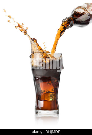 Cola pouring from a bottle into a glass Stock Photo