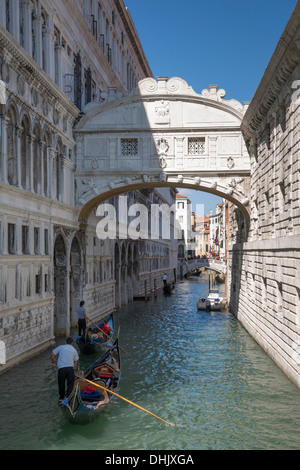 Gondolieri rowing gondolas with tourists beneath the Bridge of Sighs, Venice, Veneto, Italy, Europe Stock Photo