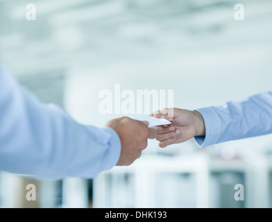 Close up of two businessmen exchanging business cards Stock Photo