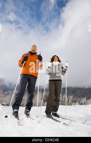 A mature couple skiing Stock Photo