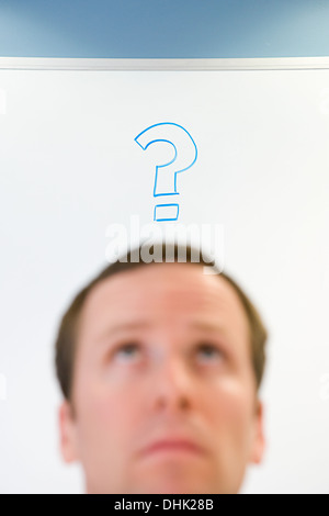 Man with question mark above his head Stock Photo