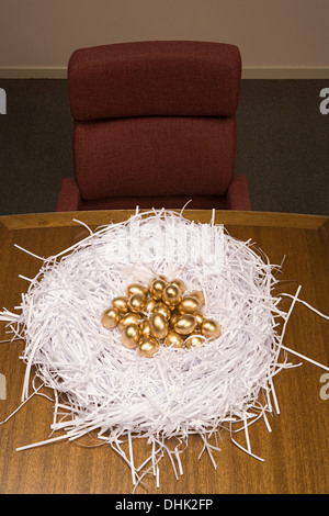 Many golden eggs in nest on white background Stock Photo - Alamy