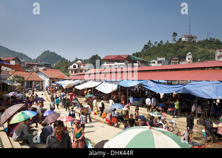 Overview of the Bac Ha market in North West Vietnam, the large covered area is where the local people are enjoying their lunch. Stock Photo