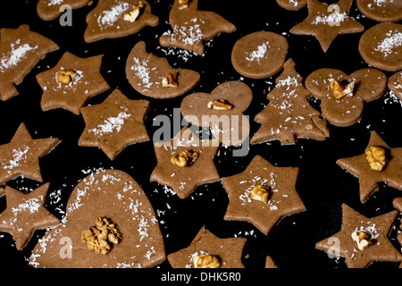 Decorated christmas gingerbread cookies ready for baking. Stock Photo