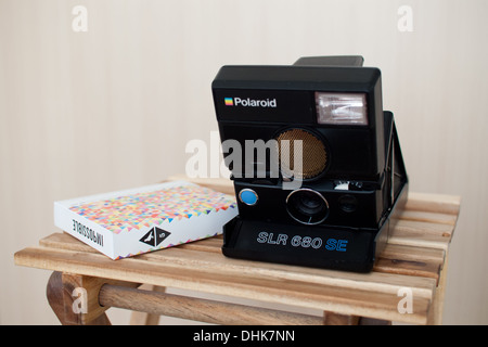A Polaroid SLR 680 SE (Special Edition) camera and Impossible x ...