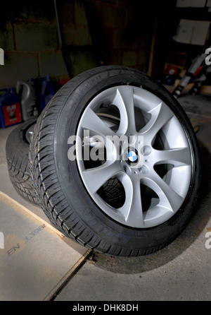 New winter Cold weather tyres (CWT) on on BMW alloy wheels ready for fitting to a car Stock Photo