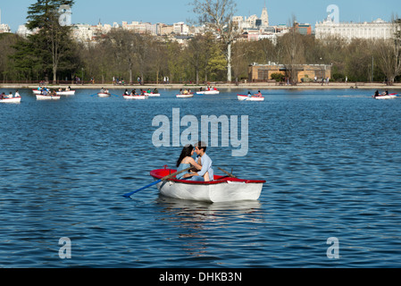 Young couple in the boating lake in Casa de Campo, Madrid, Spain Stock Photo