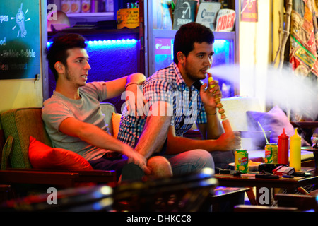 Young men at Shisha bar. Stock Photo