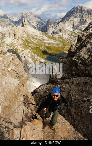 Teenager climbing on the Paternkofel fixed rope route, via ferrata, Boedenseen, Hochpustertal, Dolomites, South Tyrol, Italy Stock Photo