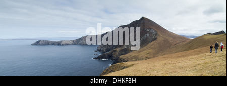 Three walkers on Achill island County Mayo Ireland Stock Photo