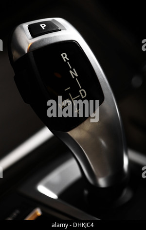 Shifter Definition Detail of an automatic gear shifter in a new, modern car Stock Photo ...