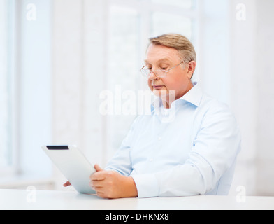 old man with tablet computer at home Stock Photo