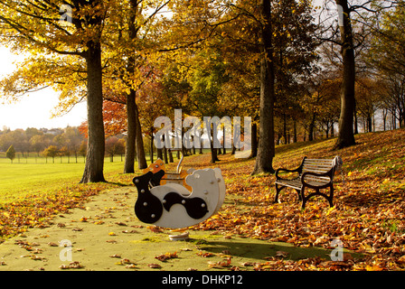 Rocking toys in the park playground on a sunny Autumn day Stock Photo