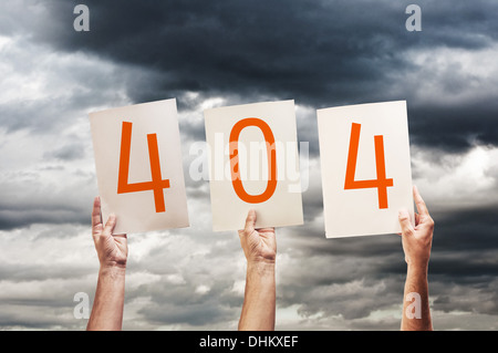 404 error, page not found. hands holding paper with printed numbers. Stock Photo