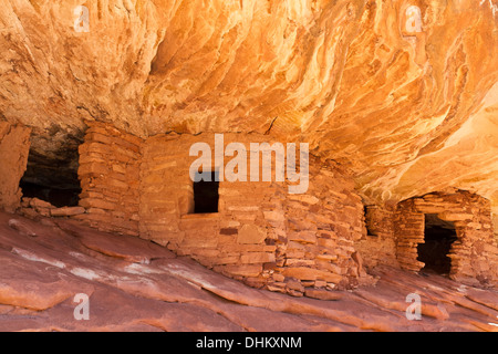 The 'House on Fire' Puebloan ruins under a cliff in Mule Canyon in the Cedar Mesa Plateau of Utah Stock Photo