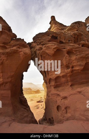 Through  arch in red mountains Stock Photo