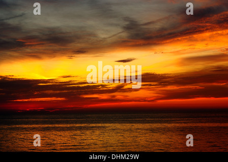 Beautiful dramatic beautiful color sunset over lake Stock Photo