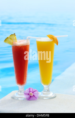Cocktails near swimming pool Stock Photo