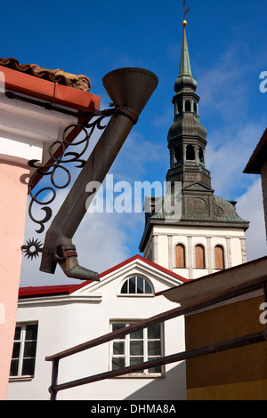 Long metal shoe and church St. Nicholas in Tallinn, Estonia Stock Photo