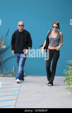 Miley Cyrus leaves Winsor Pilates class in West Hollywood with paparazzo Allison Silva Los Angeles, California - 30.04.12 Stock Photo