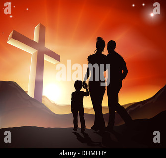 A Christian family walking towards a cross in a mountain landscape with sunrise over mountains, Christian lifestyle concept Stock Photo