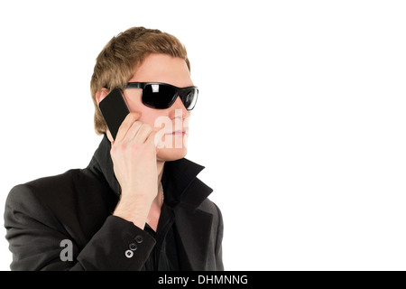 Man in black with a phone Stock Photo