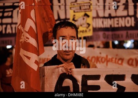 Thessaloniki, Greece. 12th Nov, 2013. A demonstrator holds a flag of an antiracism organization during the march. Anti racist organizations and trade union members demonstrated in Thessaloniki, demanding the closure of Golden Dawn far right party offices in every city in Greece. The demonstrators marched and tried to reach the Golden Dawn offices © Giannis Papanikos/NurPhoto/ZUMAPRESS.com/Alamy Live News Stock Photo