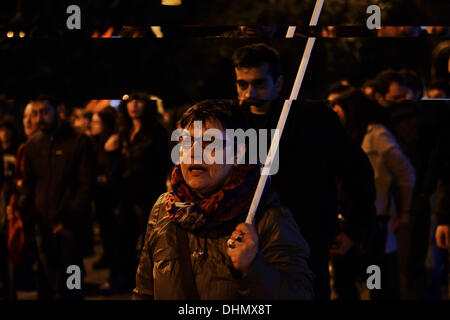 Thessaloniki, Greece. 12th Nov, 2013. A woman shouts slogans while marching. Anti racist organizations and trade union members demonstrated in Thessaloniki, demanding the closure of Golden Dawn far right party offices in every city in Greece. The demonstrators marched and tried to reach the Golden Dawn offices.Photo: Giannis Papanikos/NurPhoto © Giannis Papanikos/NurPhoto/ZUMAPRESS.com/Alamy Live News Stock Photo