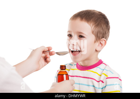 Doctor giving spoon of syrup to child boy Stock Photo