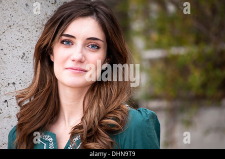Attractive blue-eyed woman grinning with copy space on the right Stock Photo