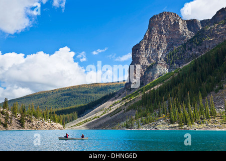 Two people  in a hire canoe on Moraine Lake Banff national Park Alberta Canada North America Stock Photo