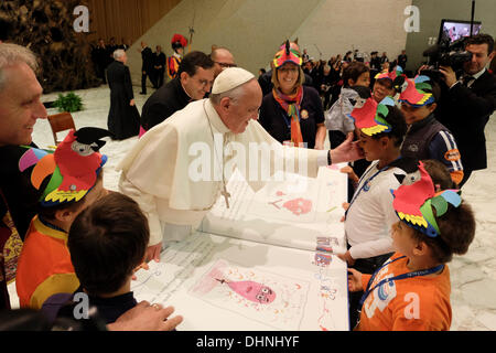 Rome, Italy. 9th November 2013. Rome meeting UNITALSI( Italian National Union for Transporting the Sick to Lourdes and International Shrines )   The childs of 'La Casa di Gigi' gift to Pope Francis a book with their drawings © Realy Easy Star/Alamy Live News Stock Photo