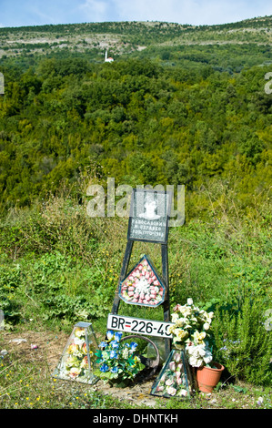 A wayside shrine devoted to a young man killed in a road accident in Crna Gora. Stock Photo