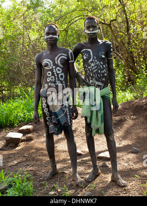 Mursi young men with painted bodies Stock Photo - Alamy