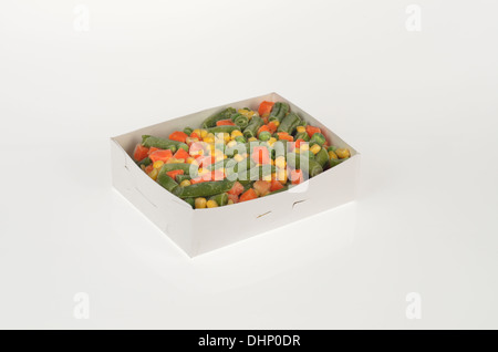 Open box of mixed frozen vegetables on white background with carrots beans peas and corn. Cutout USA Stock Photo