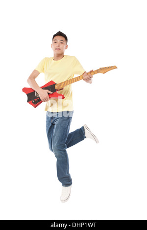 Man holding a electric guitar on shoulder Stock Photo